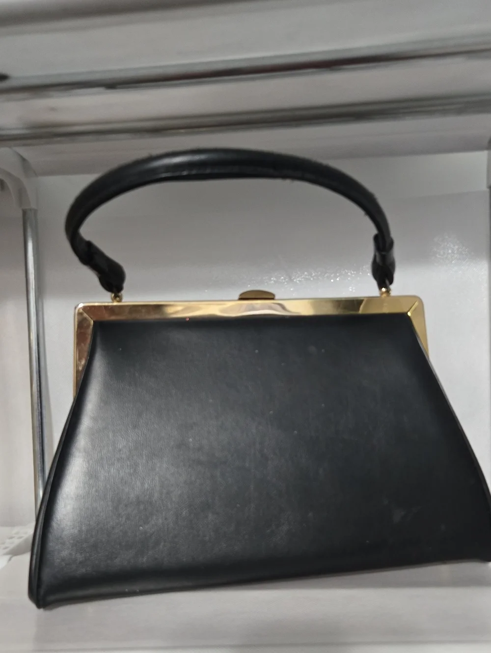 Structured Black Leather Frame Wristlet with Gold Accent